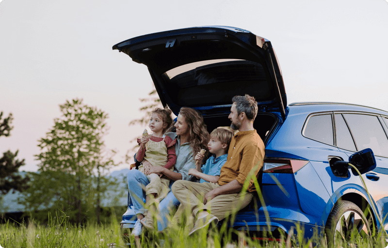 Family sitting in a car